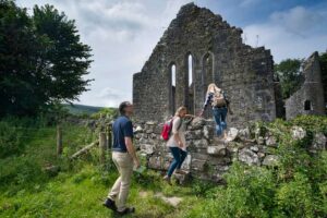 a group enters Dysert O'Dee Castle and Archeology Trail, Corofin